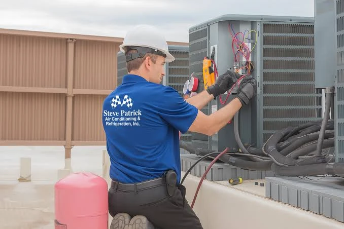 Illustrative technician testing a rooftop heating and cooling unit